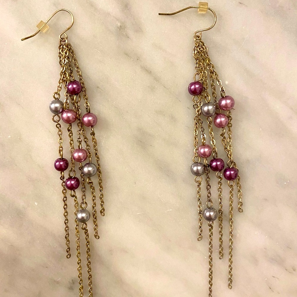 Long dangling purple balled earrings